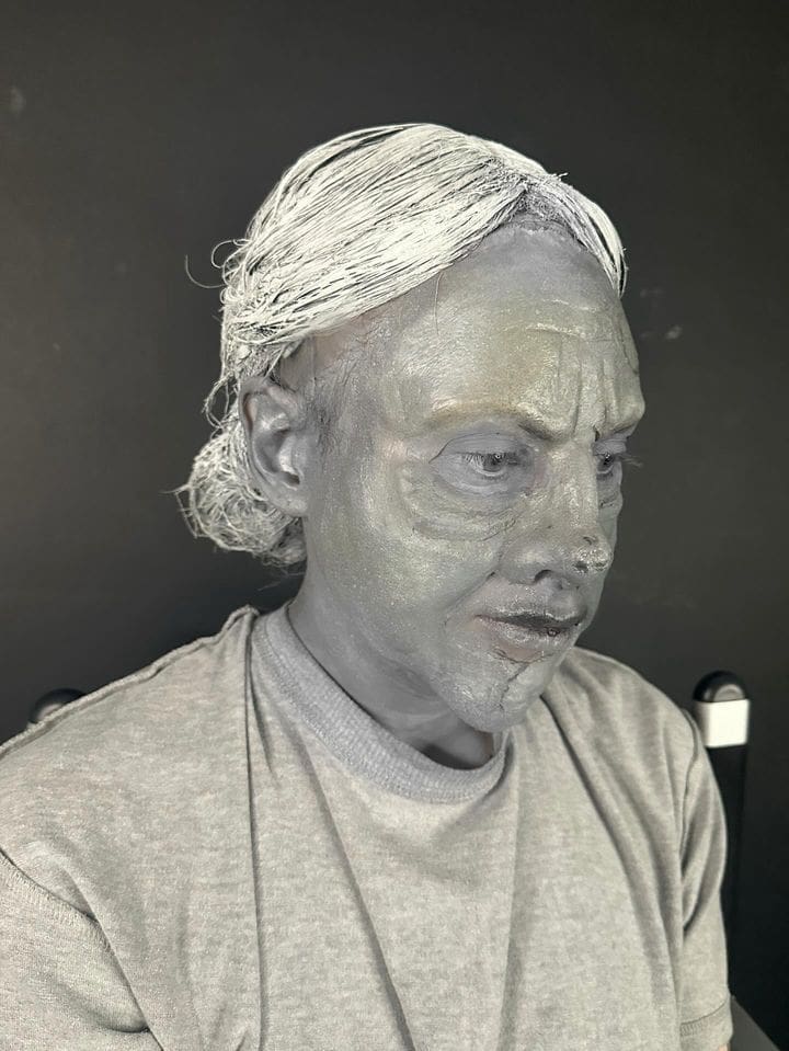 A working makeup artist on set in the UK